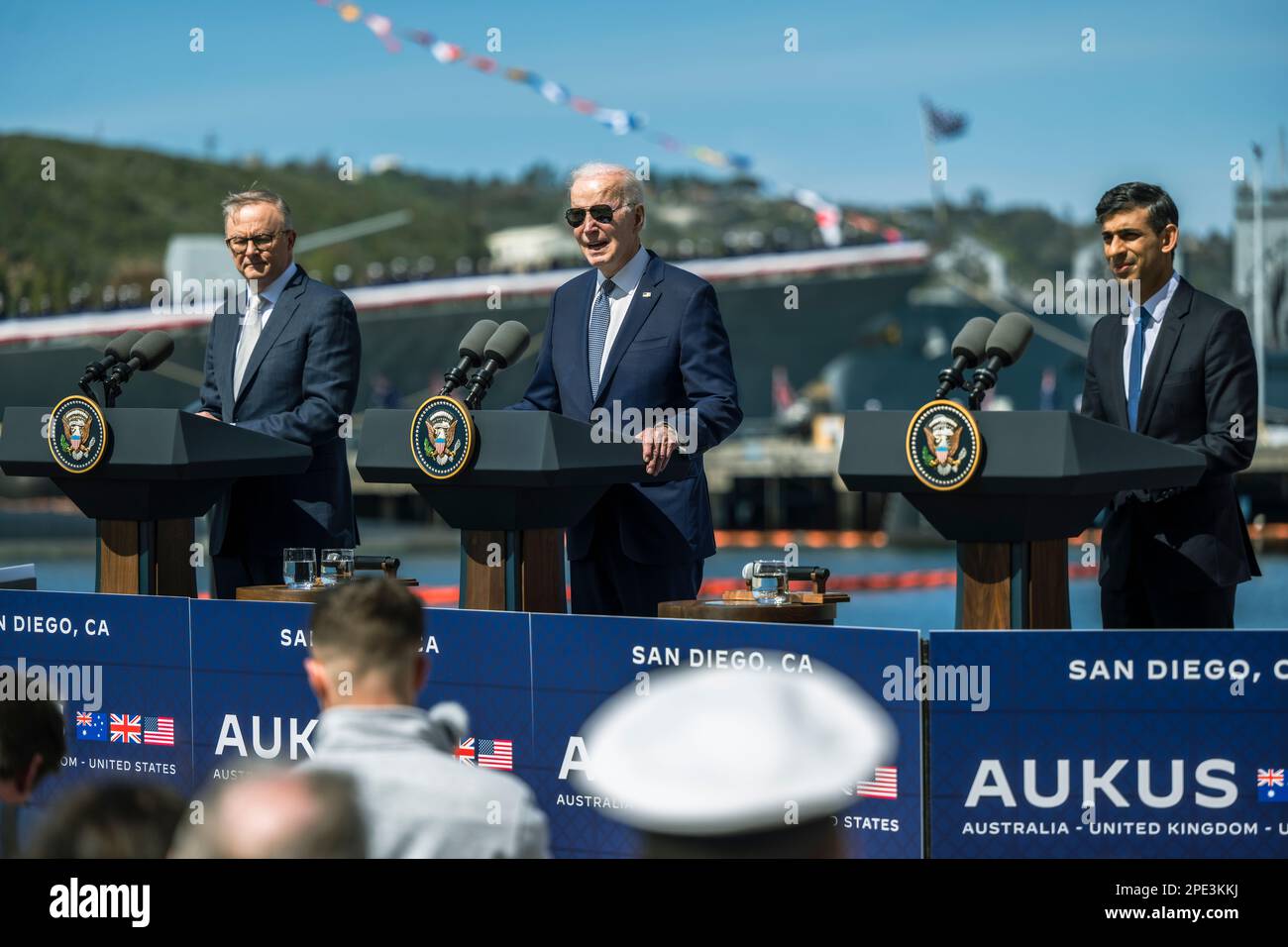 San Diego, United States of America. 13 March, 2023. U.S President Joe Biden, center, responds to a question as British Prime Minister Rishi Sunak, right, and Australian Prime Minister Anthony Albanese, left, look on during a press conference following their trilateral meeting at Point Loma naval base, March 13, 2023 in San Diego, California.  Credit: Chad McNeeley/DoD Photo/Alamy Live News Stock Photo