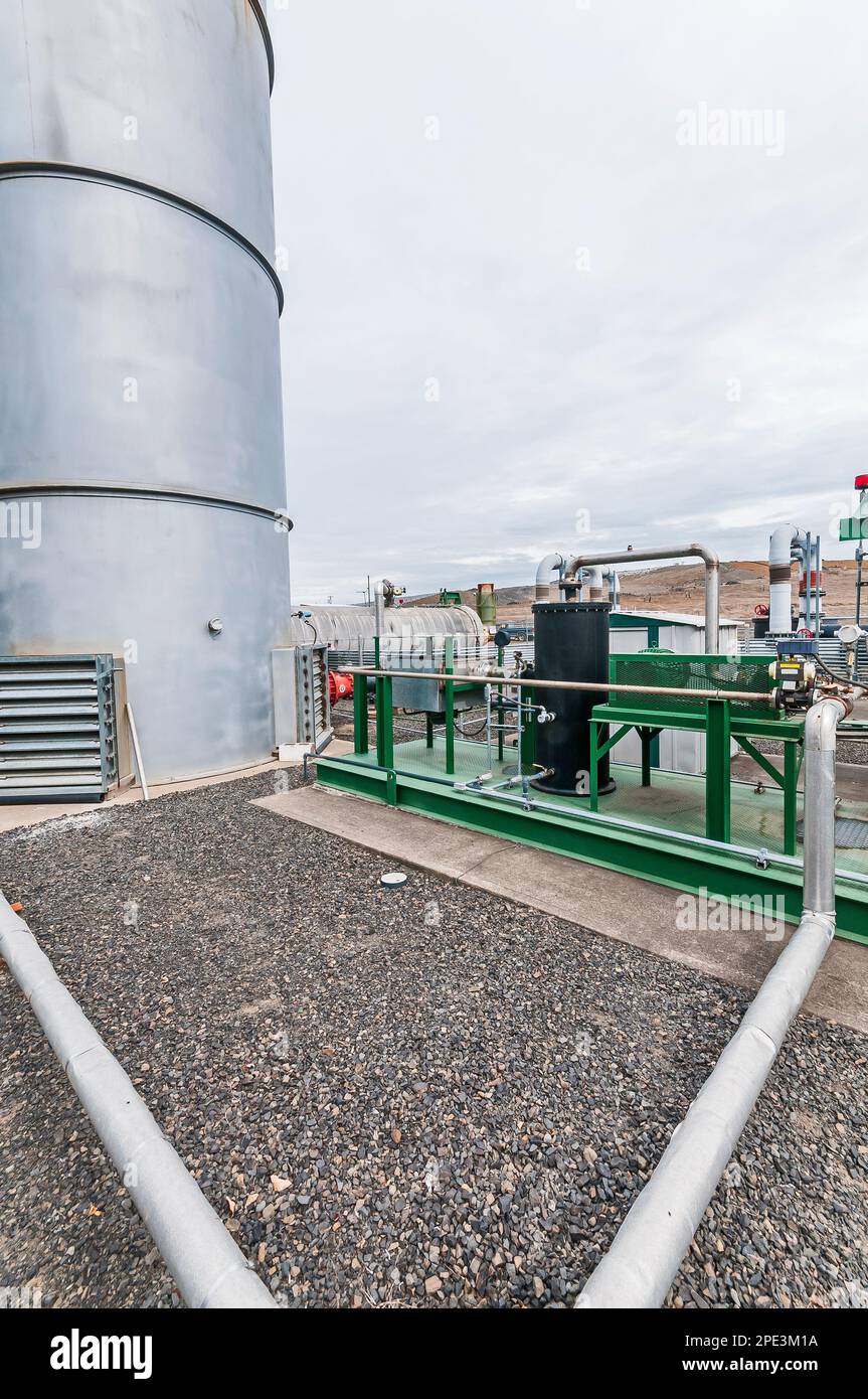 A fenced area containing tanks and piping for methane gas which is generated by and in an active