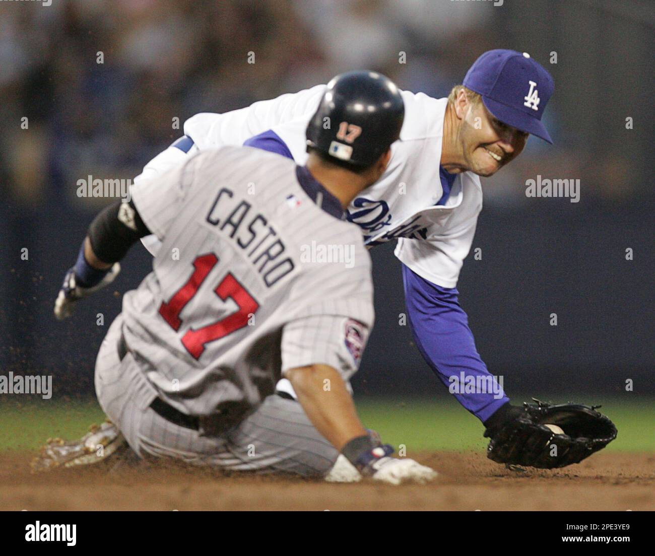 Minnesota Twins' Juan Castro is safe at second for a double as Los