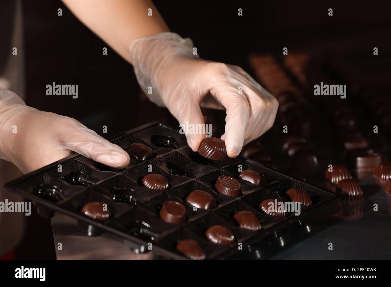 Tasty sweet candies on conveyor hi-res stock photography and images - Alamy