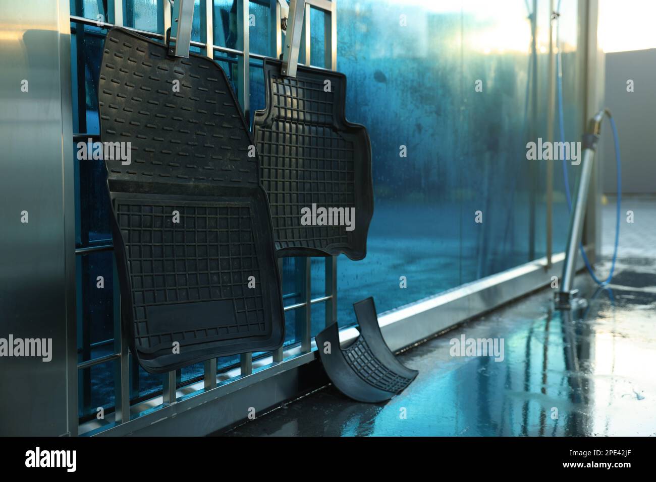 Dirty auto mats hanging at car wash Stock Photo Alamy