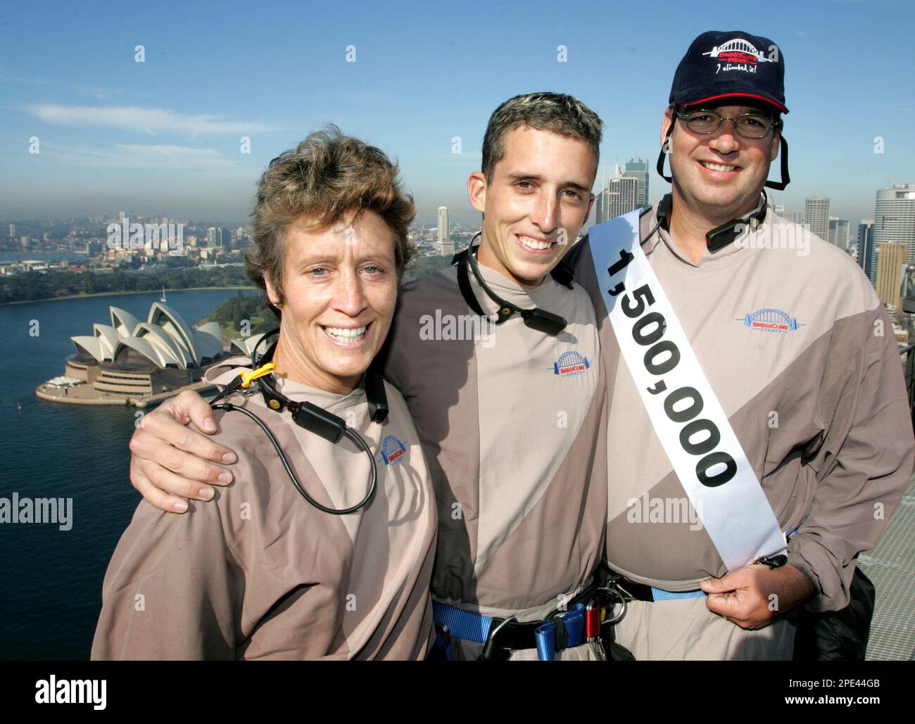 The 1.5 millionth Sydney Harbour Bridge climber, Christopher Schenkel,  right, of Fort Worth, Indiana, and his wife Anne and son Chris stand on the  summit of the Australian Icon, Thursday, June 9,