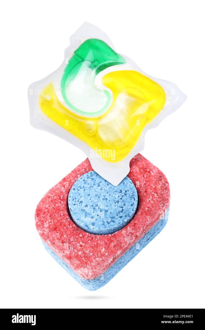 Dishwasher detergent tablet and gel capsule falling on white background