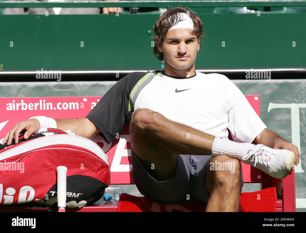 Swiss player Roger Federer sits on his bench, and refuses to go back on the  court during the third set at his first round tennis match against Robin  Soderling from Sweden at