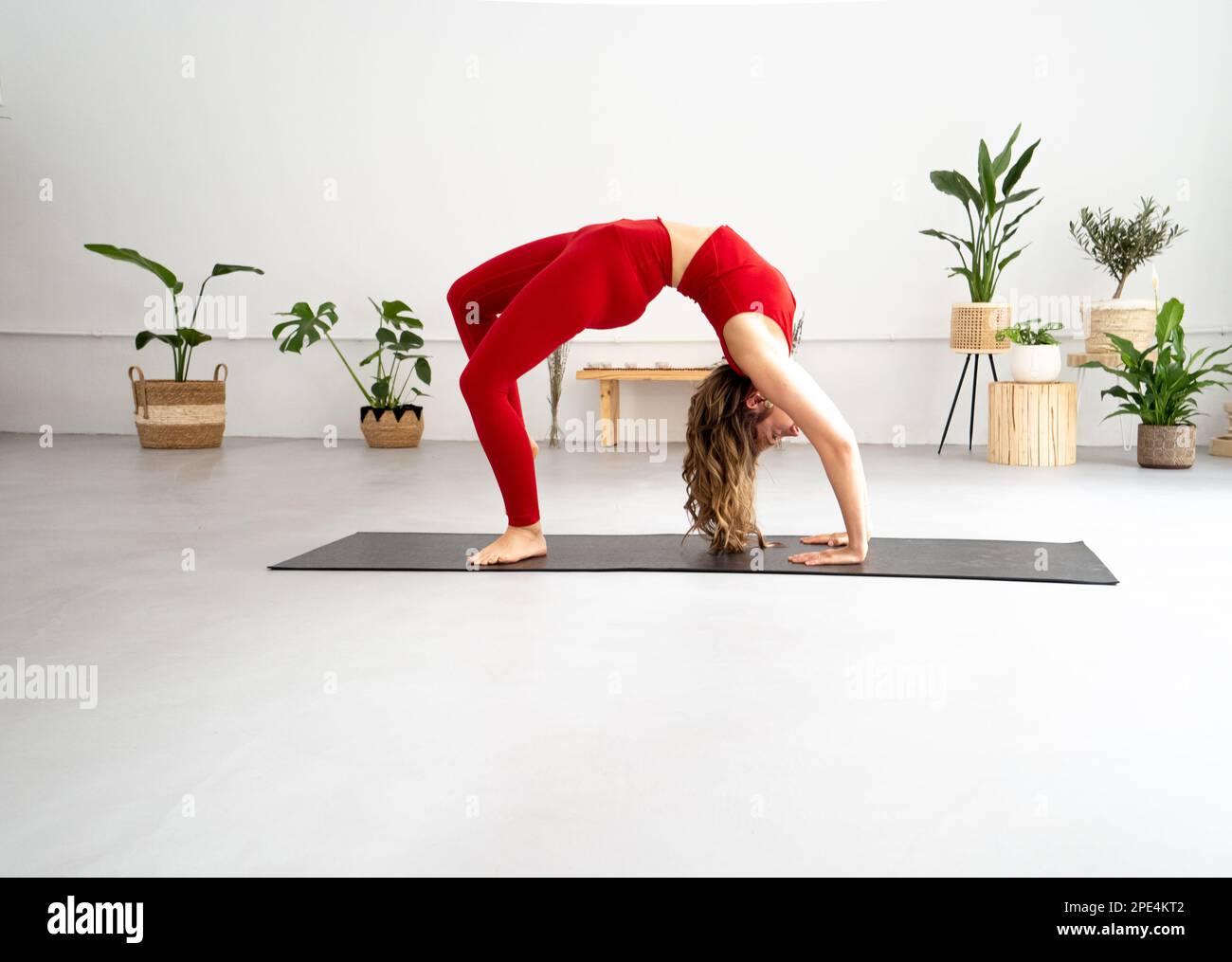 Caucasian woman practices yoga in a yoga studio. Zen, meditation, Mindfulness, spirituality  Stock Photo