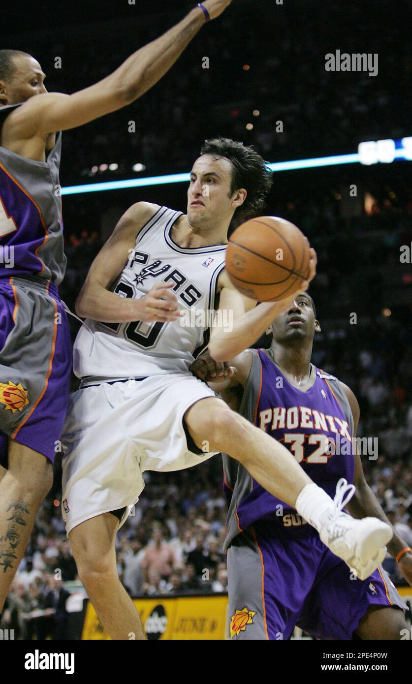 San Antonio Spurs' Manu Ginobili (20), of Argentina, looks to pass the ball  as Phoenix Suns' Amare Stoudemire (32) and Shawn Marion, left, defend  during Game 4 of the Western Conference Finals