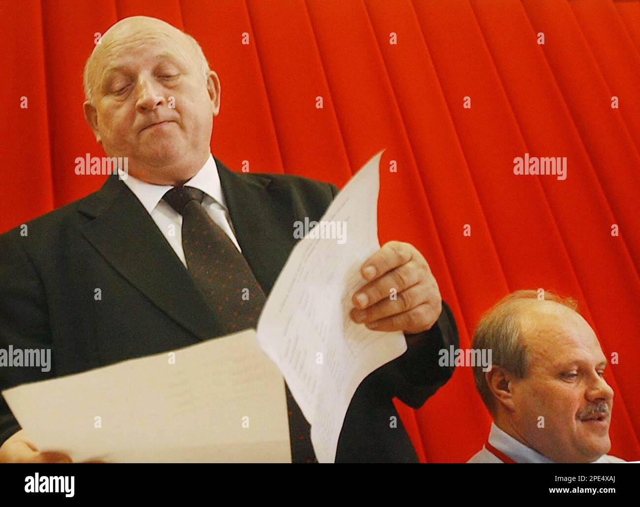 Jozef Oleksy, outgoing chairman of Poland's embattled governing party, the  Democratic Left Alliance, looks over the text of his speech before  addressing a party convention in Warsaw, Poland, Sunday May 29, 2005.