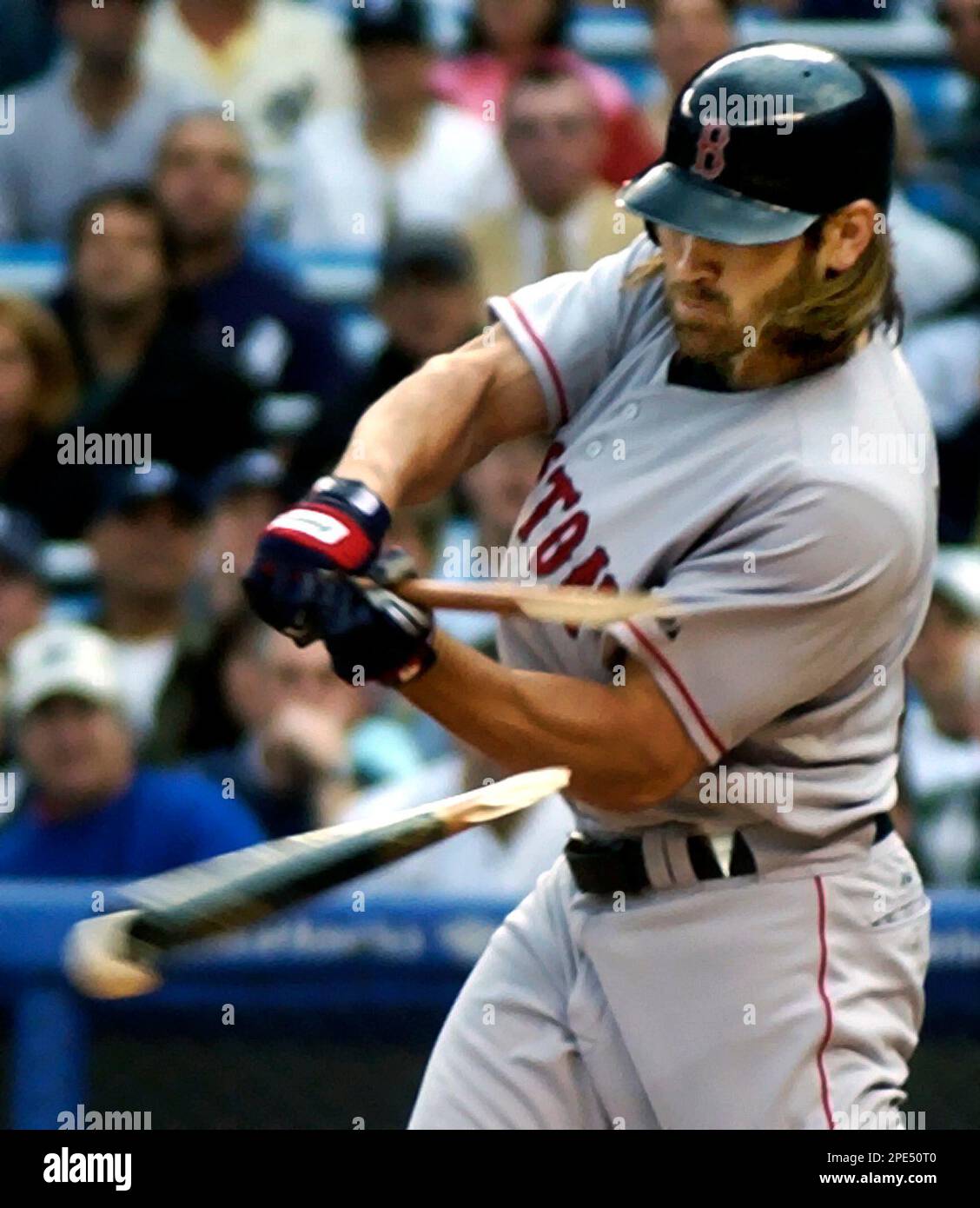 Boston Red Sox batter Johnny Damon breaks his bat on a pitch by