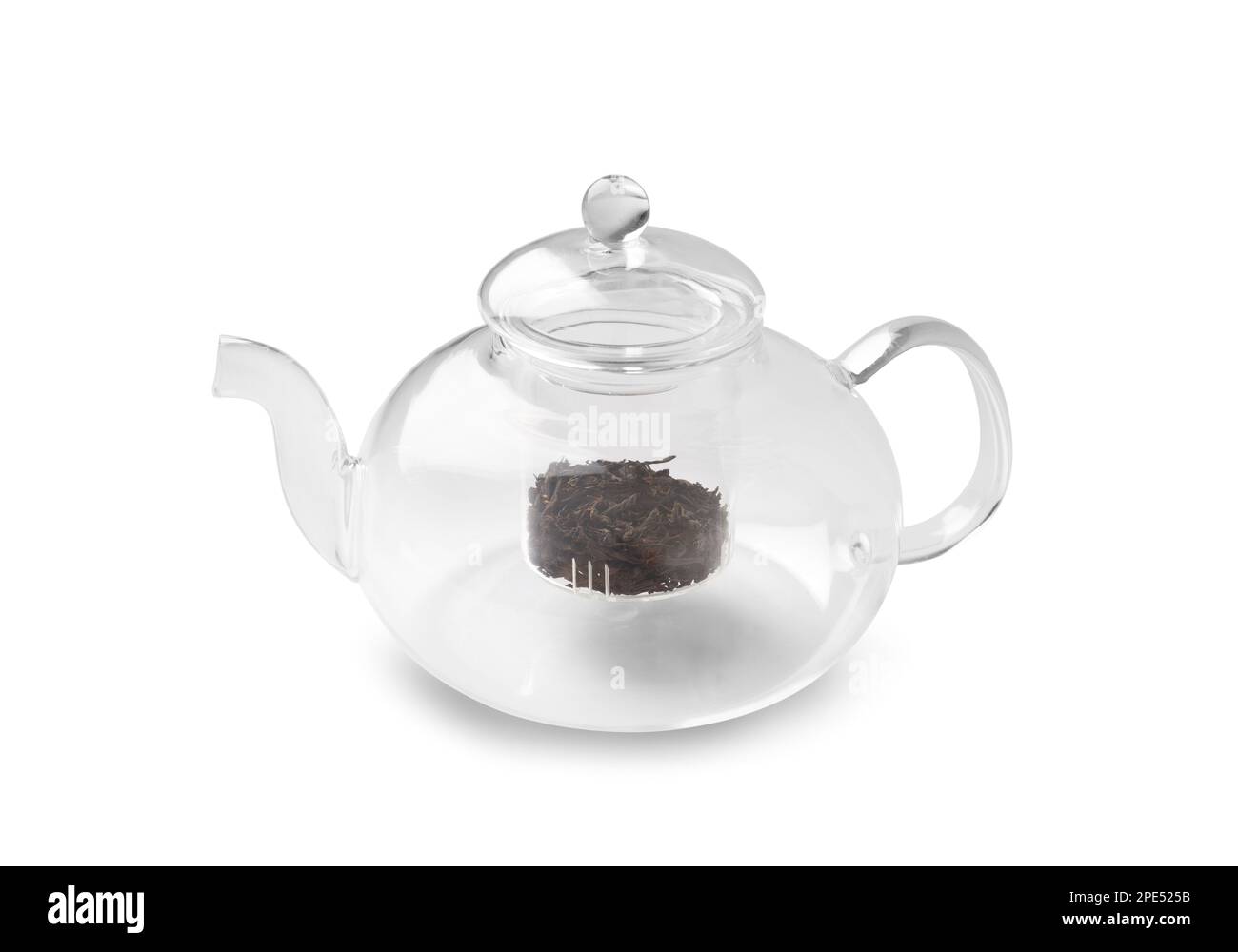 Empty glass transparent teapot and dry green tea in it on a white