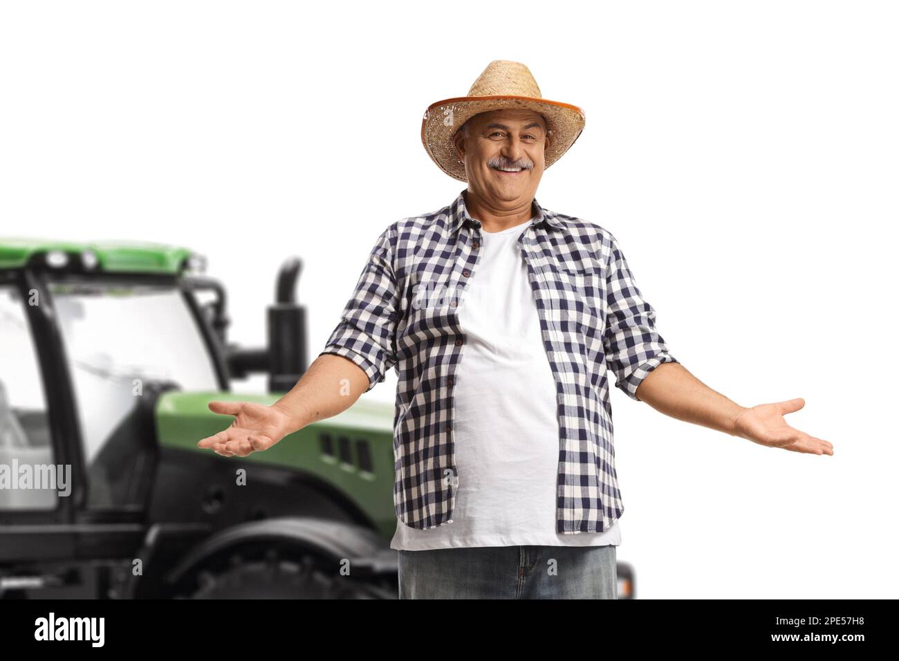 Smiling mature farmer with a straw hat gesturing with hands isolated on white background Stock Photo