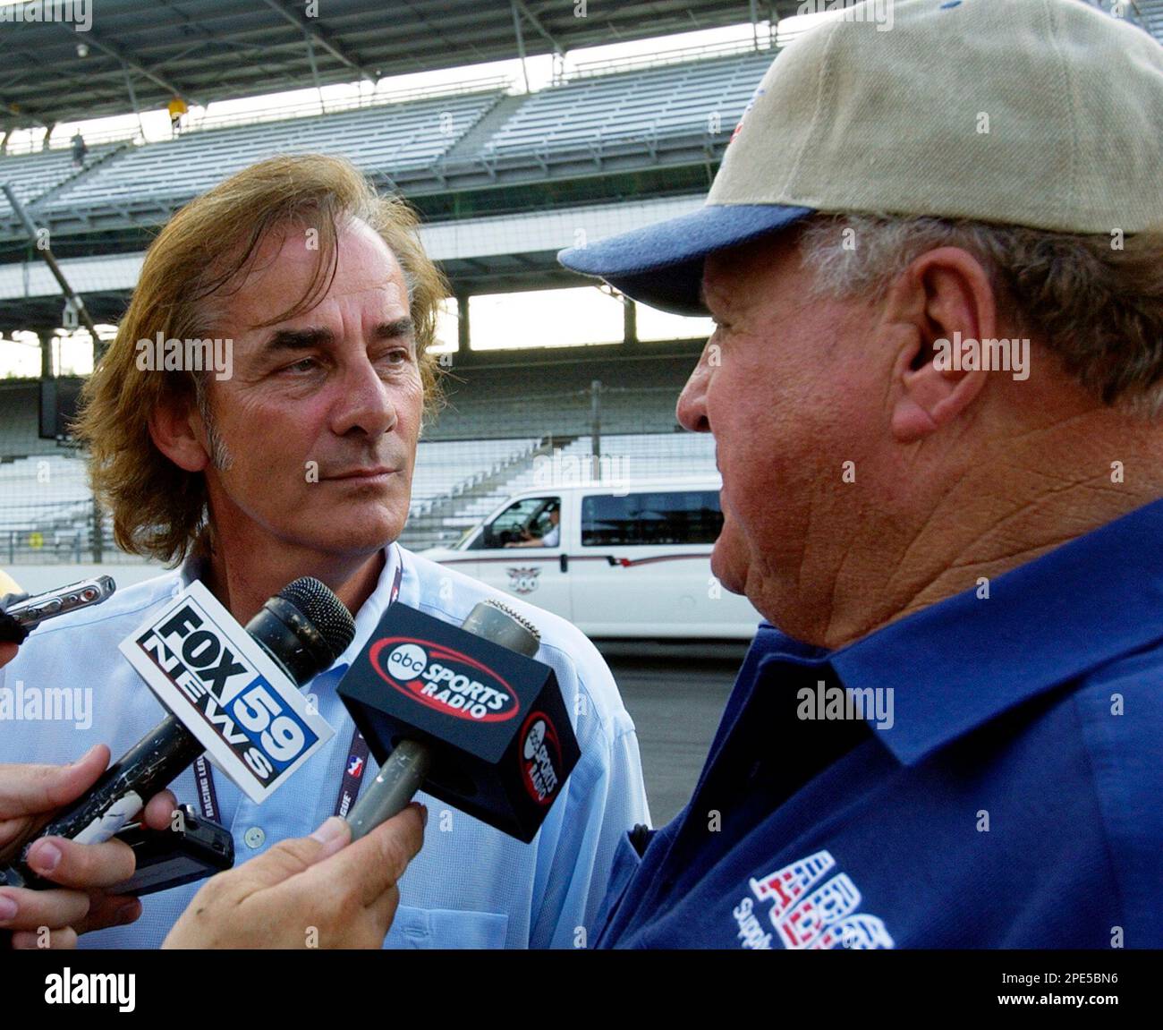 Indy Racing League car owner A.J. Foyt, right, talks with Arie Luyendyk ...