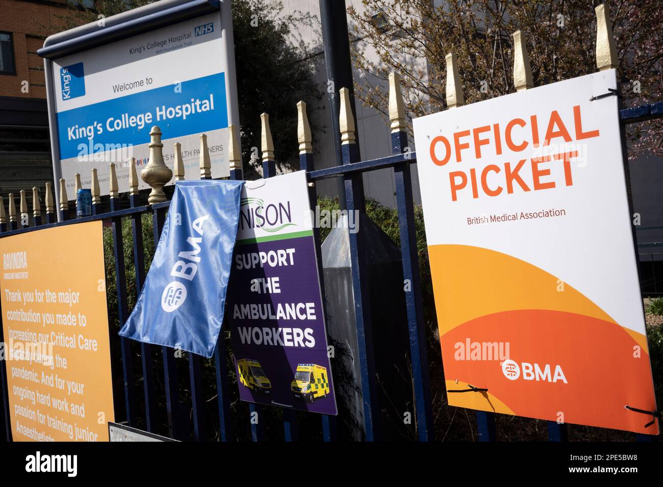 On the second of their three-day nationwide industrial action, BMA union placards are seen on railings outside Kings College Hospital, on 14th March 2023, in London, England. The walkout by British Medical Association as many as 61,000 junior or trainee doctors who are staging the 72-hour stoppage in pursuit of a 26% pay rise and during in the week when the government's budget is announced. Stock Photo