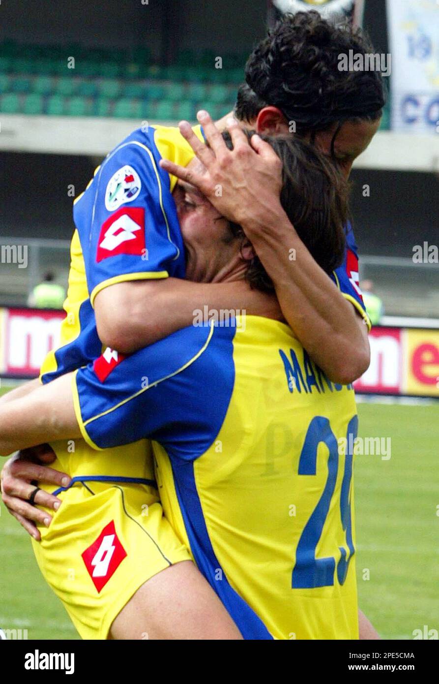 Chievo Verona defender Davide Mandelli, right, celebrates with his temmate  Franco Semioli during the Italian first division soccer match between Chievo  Verona and Bologna at the Bentegodi stadium in Verona, Italy, Sunday,