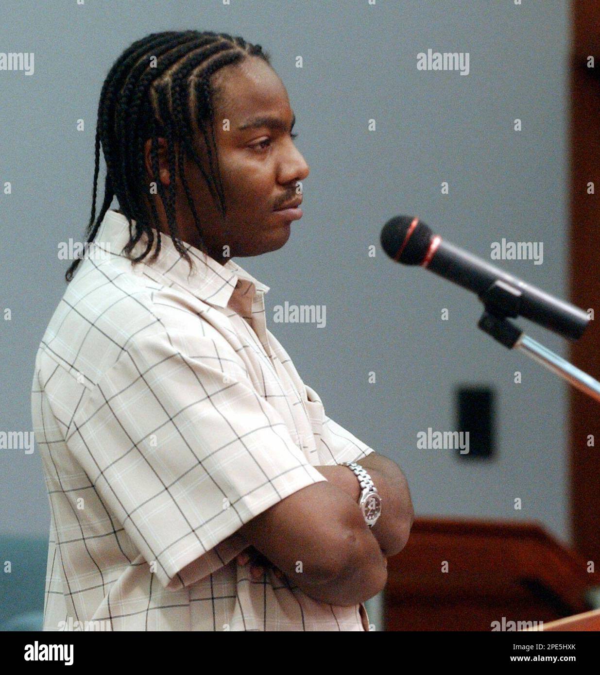 Elliott rashad harper listens during his sentencing in a courtroom in