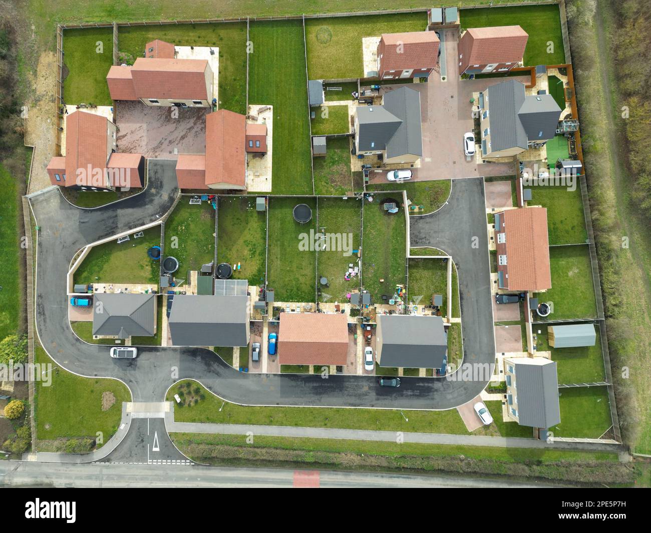 Top down drone view of a small housing development at the edge of an East Anglian village. Both private and affordable housing is located here. Stock Photo