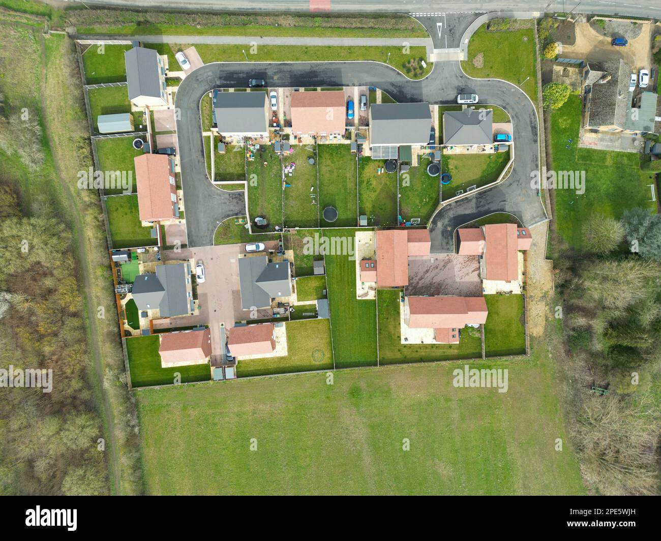Top down drone view of a small housing development at the edge of an East Anglian village. Both private and affordable housing is located here Stock Photo