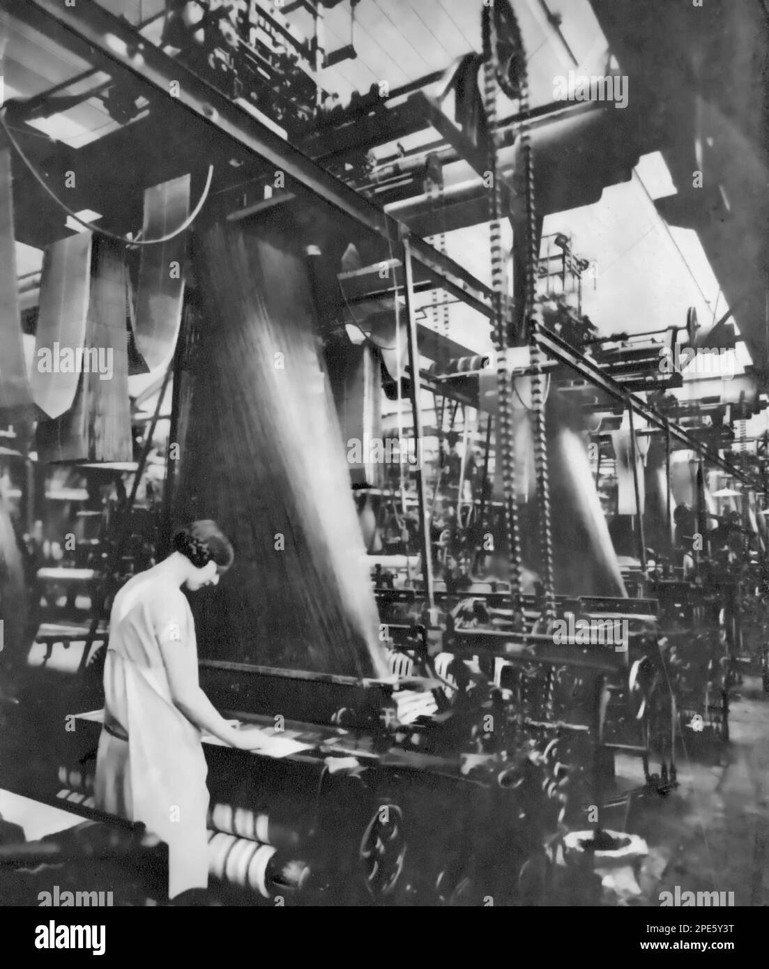 Machine weaving at the Horrockses, Crewdson & Co. factory, c1933. Horrockses, Crewdson & Co. was a textile company based in Preston, Lancashire. Stock Photo