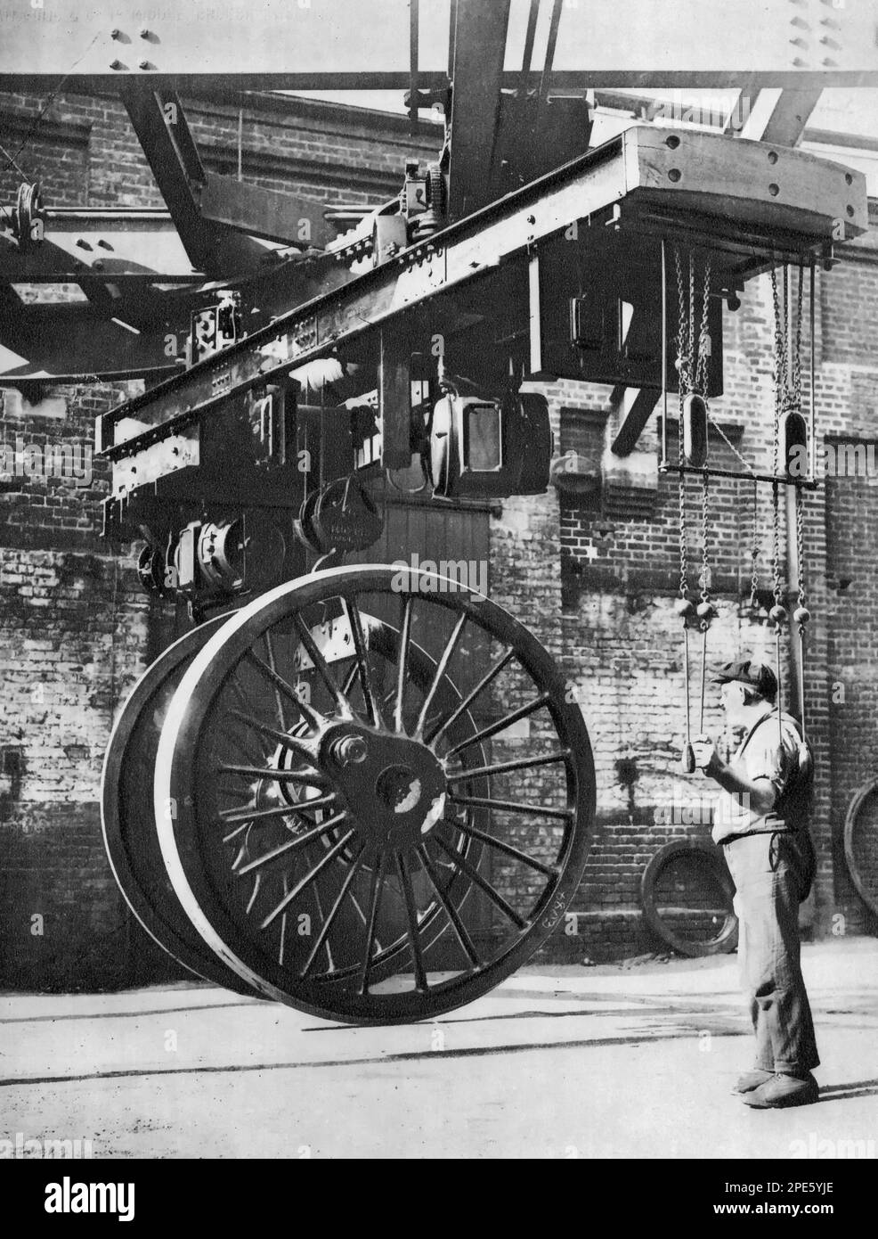 An electric runway being used to move the wheels of a steam locomotive, c1933. Stock Photo