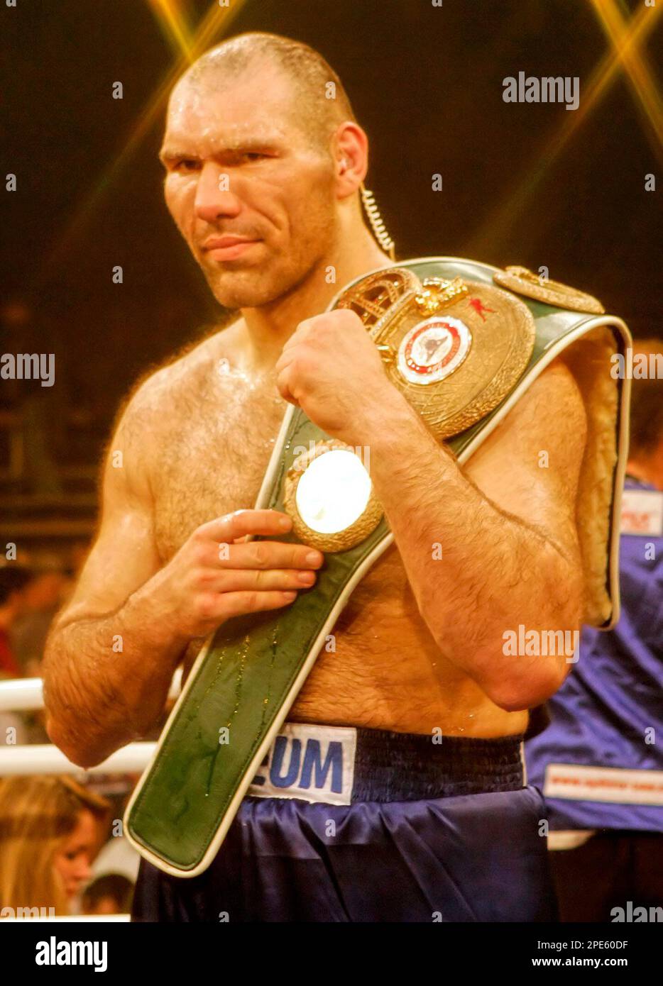 Russian boxer Nicolai Valuev celebrates with his champion belt after he has  knocked out his challenger US boxer Clifford Etienne in the third round  during their heavyweight WBA Intercontinental title bout in