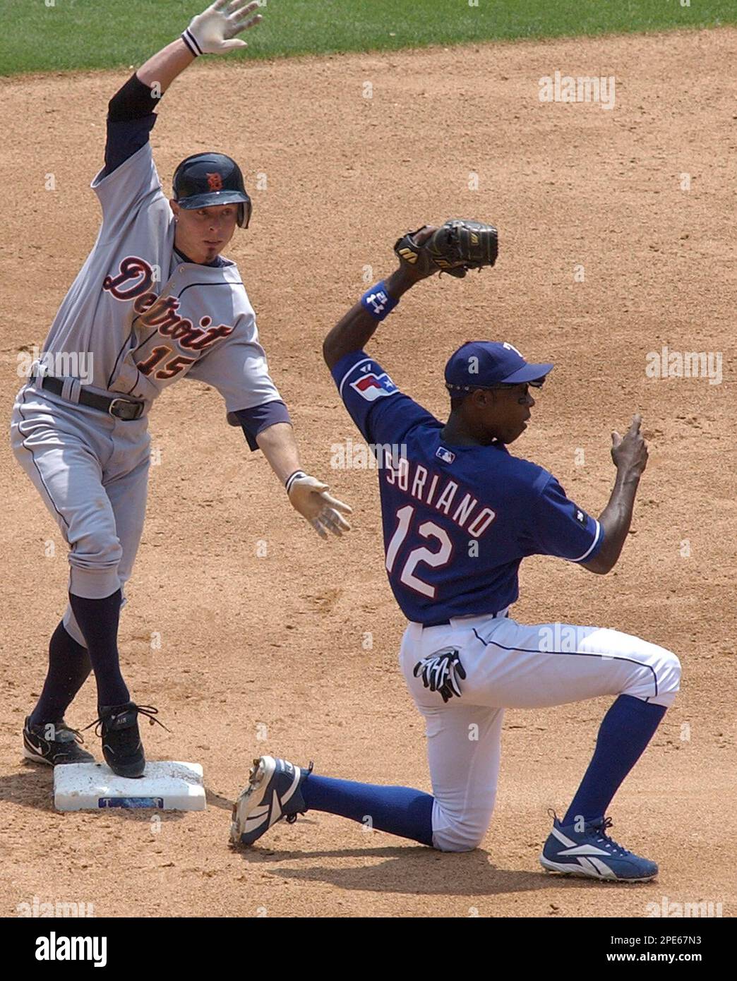 Texas Rangers shortstop Elvis Andrus throws over umpire Alfonso