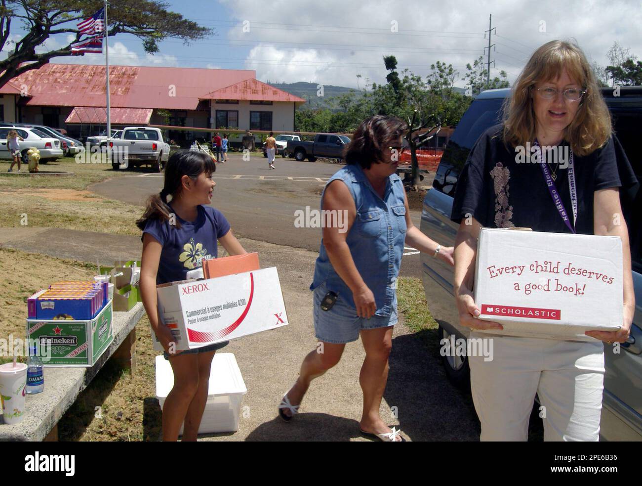Kalaheo Elementary School student Nicole Ogawa helps her mother, Jean