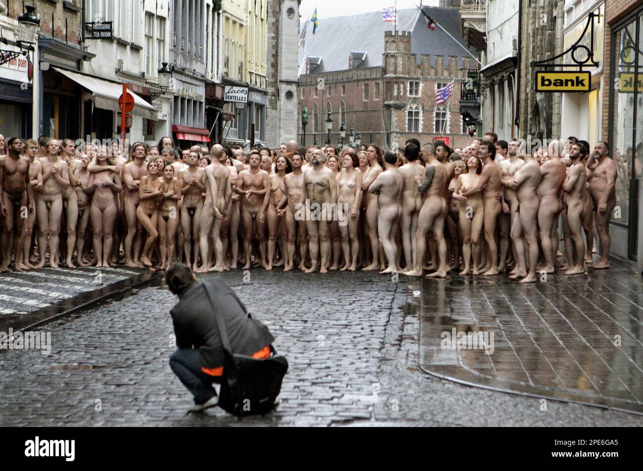 NOTE NUDITY ** About 1,950 unclothed men and women pose downtown the old  city center of Bruges, Belgium, Saturday, May 7, 2005, as they are  photographed by U.S. artist Spencer Tunick