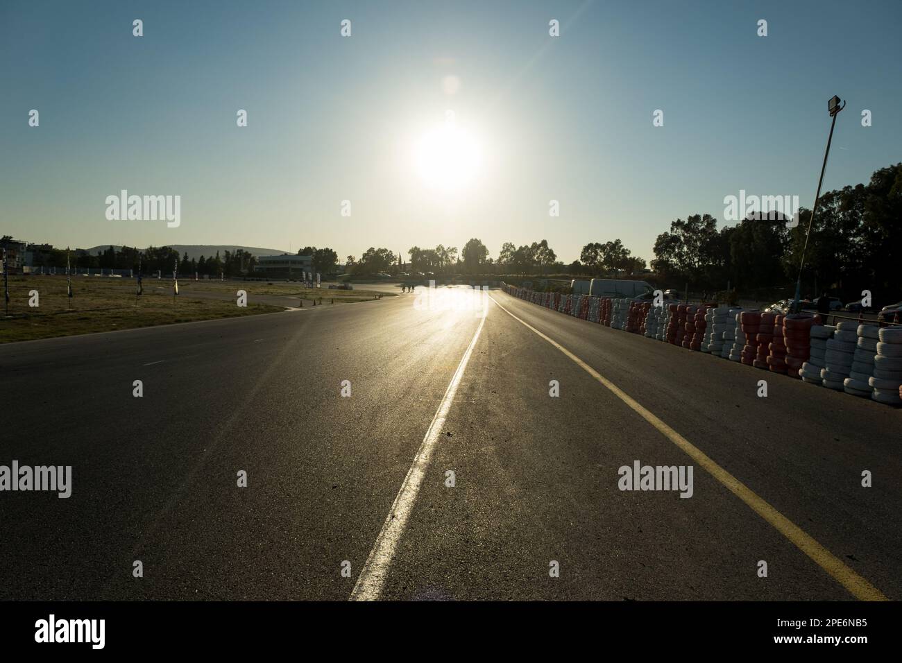 Road view of race track with some barrier tires. Stock Photo