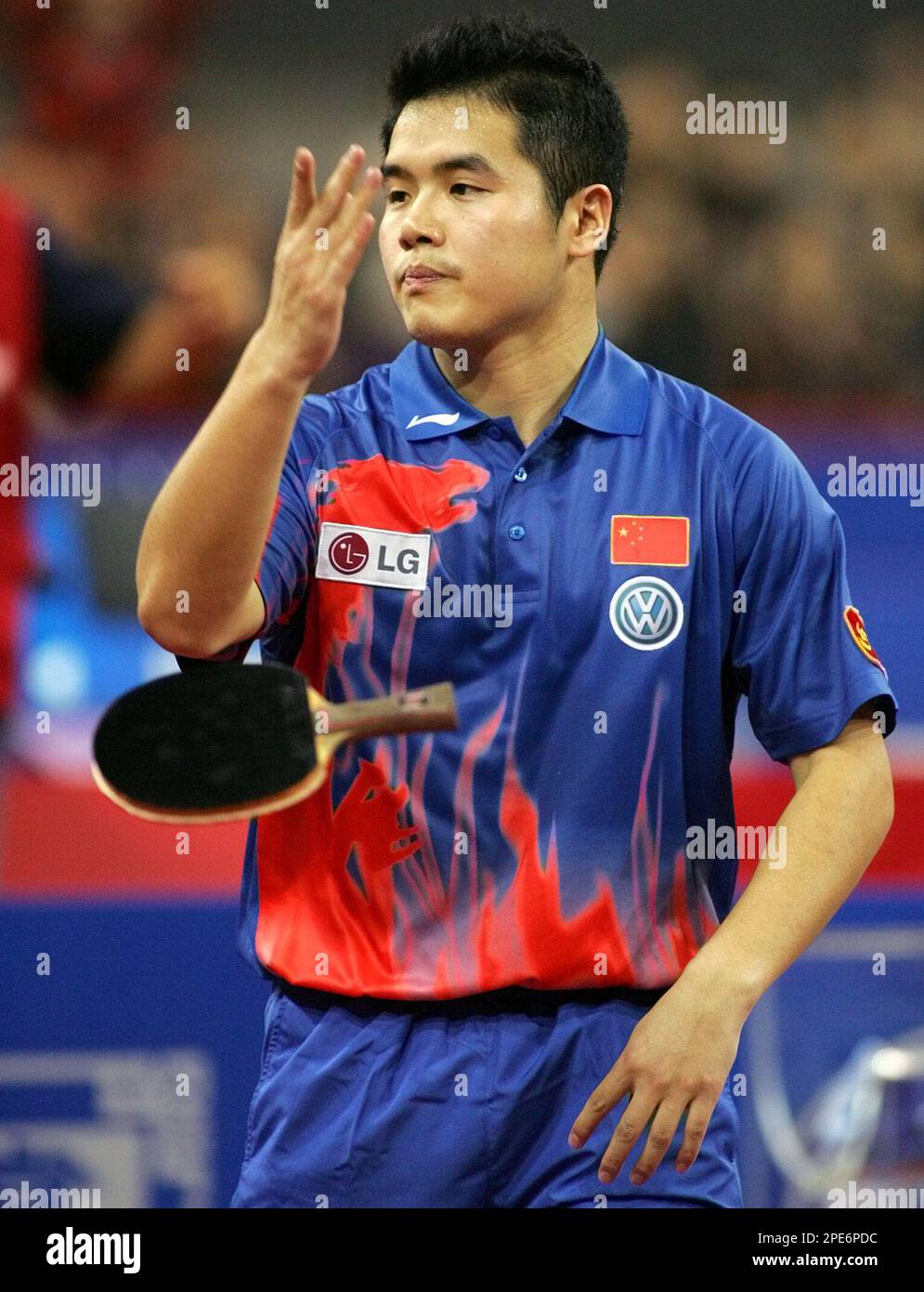 China's Liu Guozheng tosses his bat after defeating Germany's Timo Boll ...