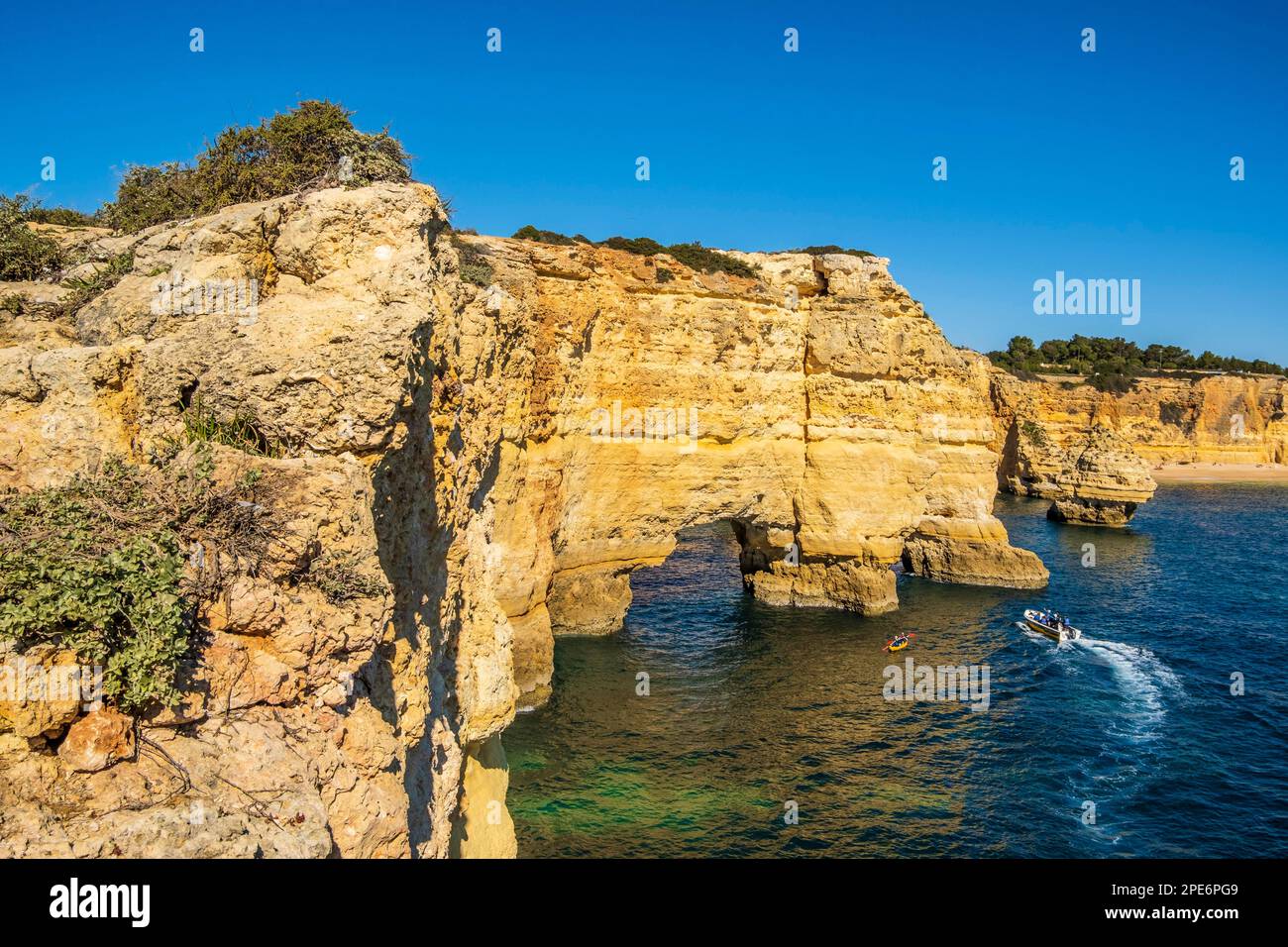 Beautiful cliffs and rock formations by the Atlantic Ocean at Marinha Beach in Algarve, Portugal Stock Photo
