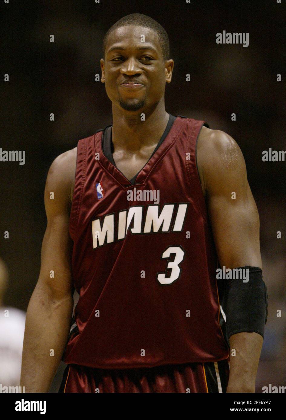 Miami Heat s Dwyane Wade smiles as he leaves the court after the