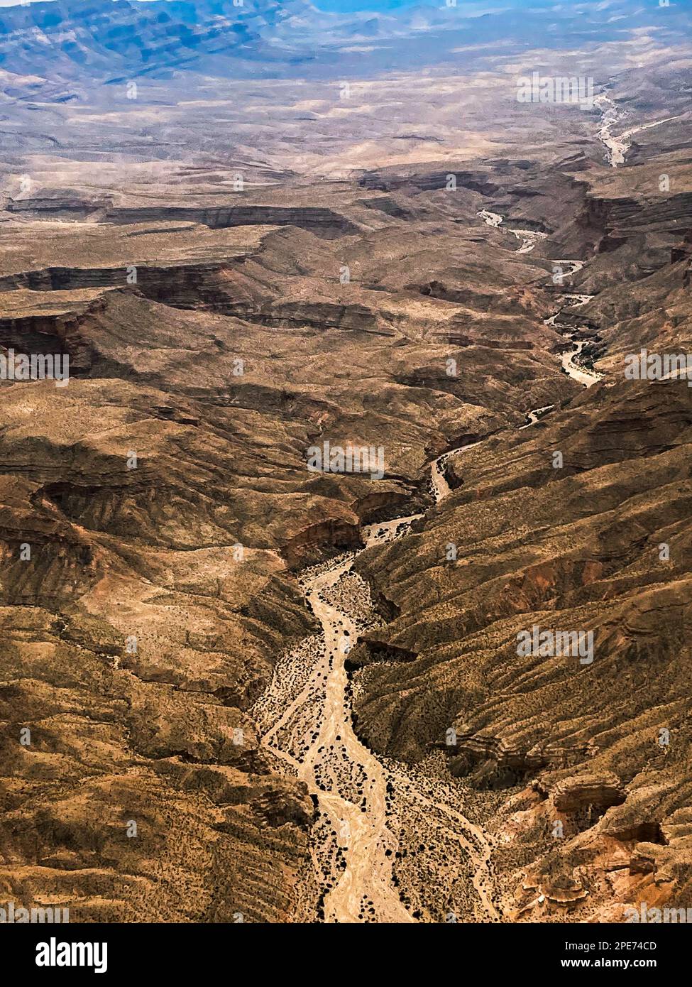 Aerial view of mountains with a - Aerial View Of Mountains With A Dry Arid River Bed In The Grand Canyon Area Arizona And Nevada Around Las Vegas 2PE74CD 