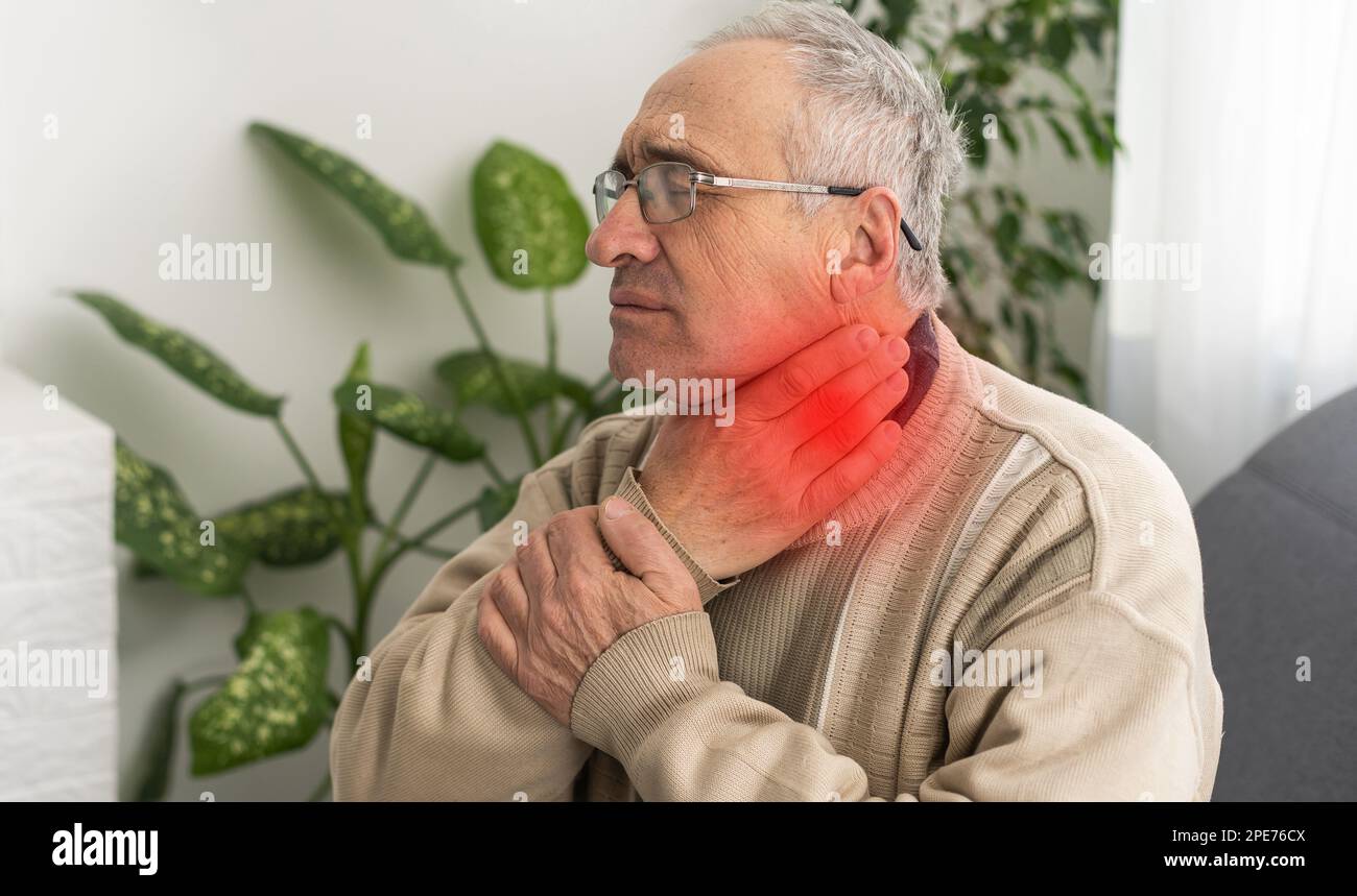 Male face with a painful red spot on the neck. Concepts of problems with thyroid or sore throat