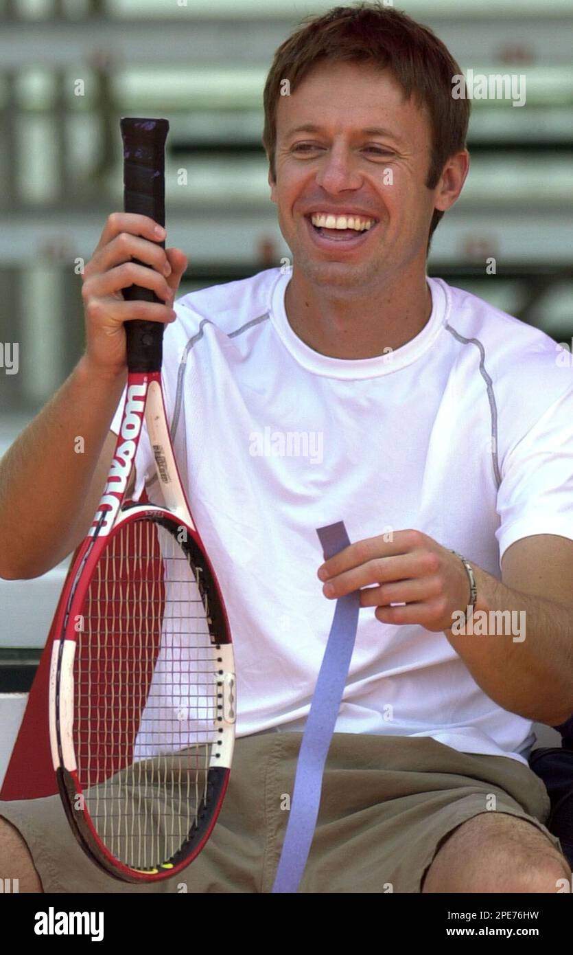 canadas-daniel-nestor-jokes-with-teammates-as-he-prepares-his-racket-before-a-training-session-at-the-rafael-yanez-gordils-tennis-complex-in-valencia-110km-66-miles-from-caracas-venezuela-thursday-april-28-2005-ahead-of-an-american-zone-group-one-davis-cup-semifinal-tournament-against-venezuela-beginning-april-29-nestor-will-only-play-in-the-doubles-match-with-teammate-frederic-niemeyer-on-saturday-ap-photoleslie-mazoch-2PE76HW.jpg