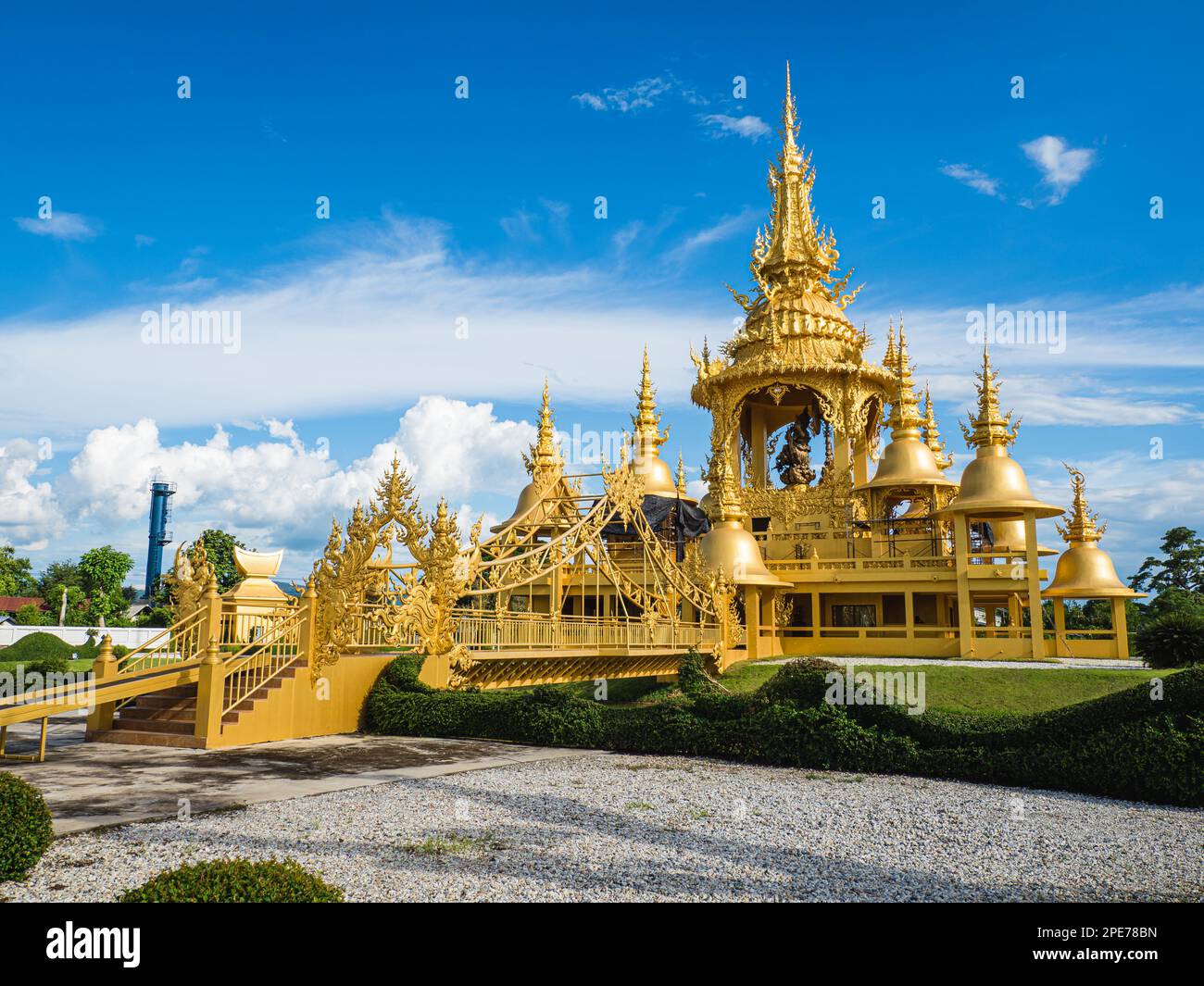 A beautiful Wat Rong Khun White Temple with golden buildings in Chiang ...