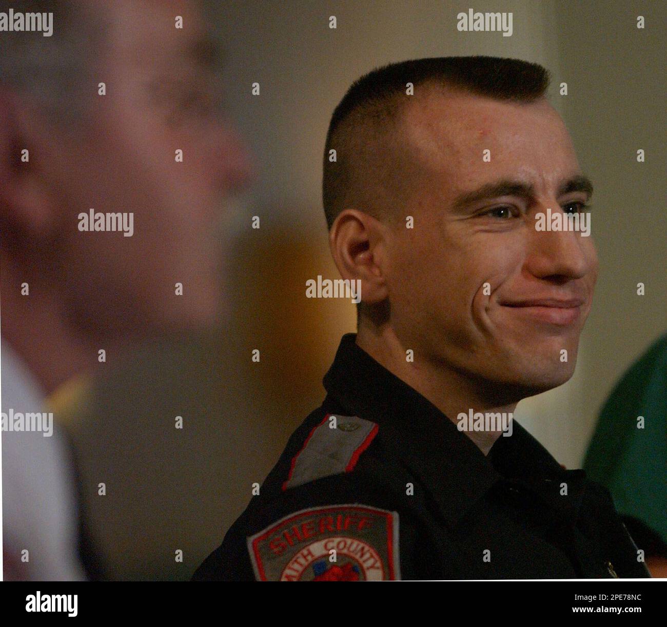 Smith County Sheriff's Deputy Sherman Dollison, right, smiles during a