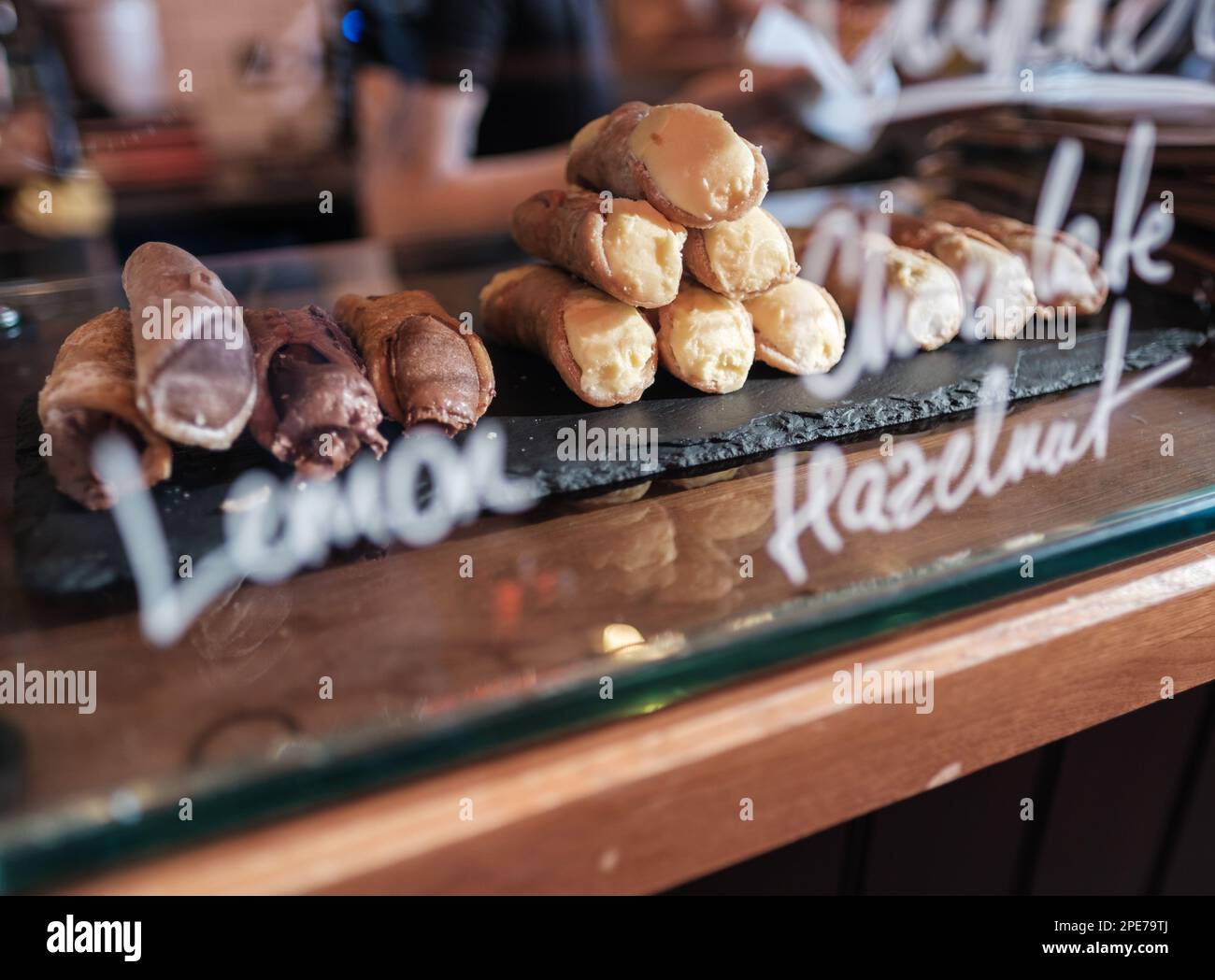 Delicious Cannoli Pastries For Sale In A trendy Cafe, Deli Or Bakery Stock Photo