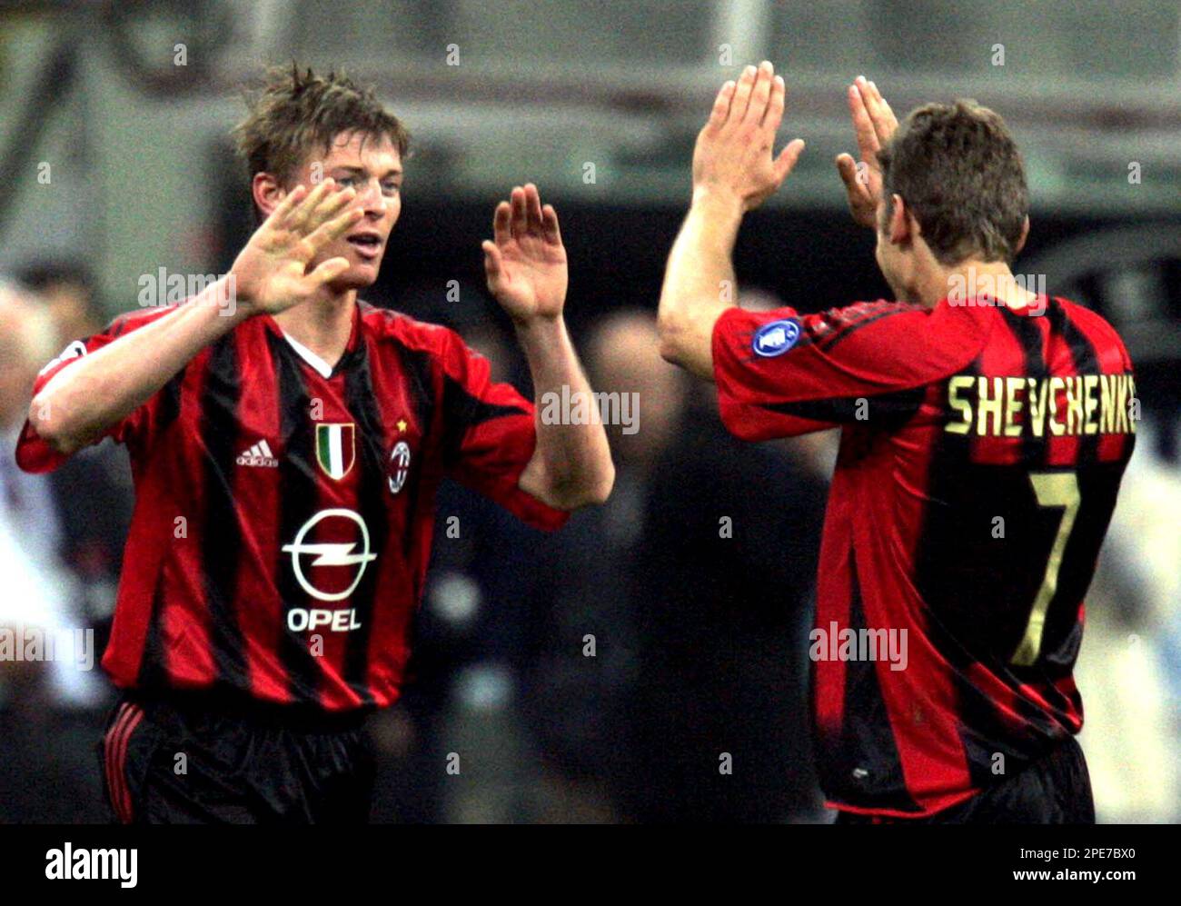 A.C. Milan's forward Jon Dahl Tomasson of Denmark, left, celebrates with  his teammate striker Andriy Shevchenko of Ukraine after scoring against PSV  Eindhoven during the Champions League semi-final first leg soccer match