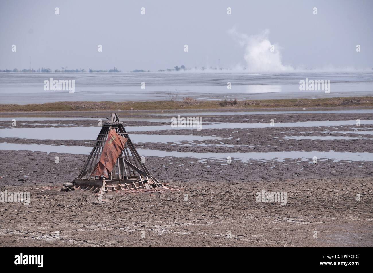 Mosque buried in mud lake of mud volcano, environmental disaster that developed after drilling incident, Porong Sidoarjo, near Surabaya, East Java Stock Photo