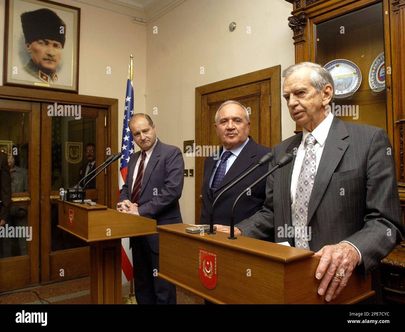 Turkey's Defense Minister Vecdi Gonul is flanked by U.S. ambassador to Turkey Eric Edelman, left, and Jerry R. Jones of Lockheed Martin Global, Inc., after their meeting in Gonul's office in Ankara on Tuesday, April 26, 2005. They announced that the U.S. and Turkey have come to a US$1.1 billion (euro 850 million) agreement to upgrade Turkey's fleet of 217 F-16 warplanes. (AP Photo/Burhan Ozbilici) Stock Photo