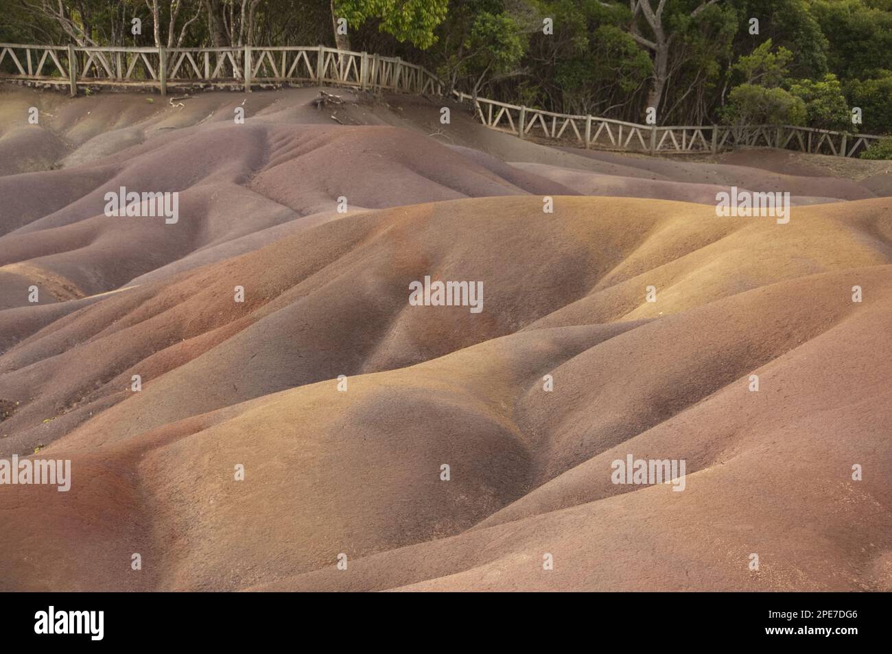 View of sand dunes comprising of different coloured sands, caused by decomposed basalt gullies of ferralitic soil, red colour caused by iron Stock Photo