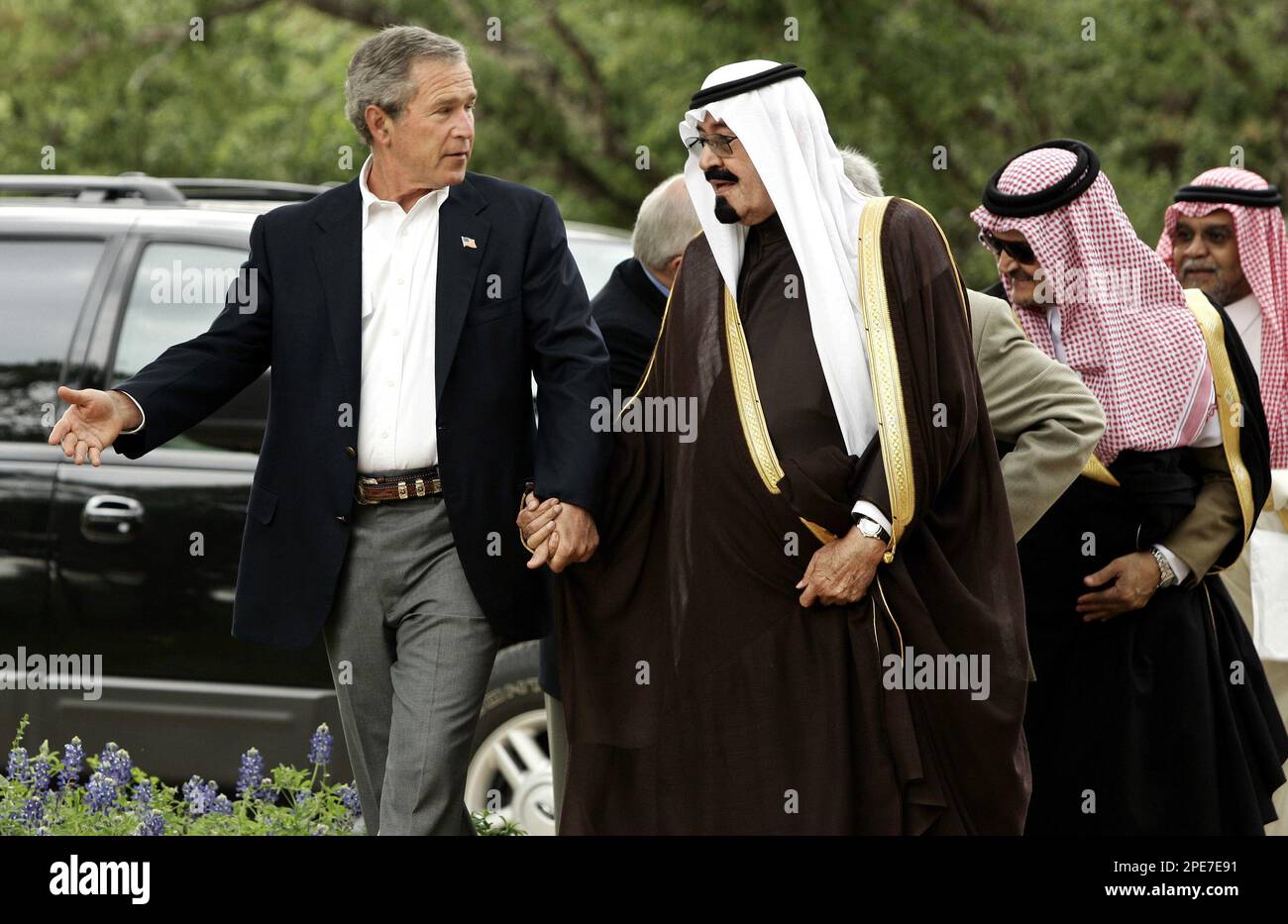 ** RETRANSMISSION FOR ALTERNATE CROP ** President Bush greets Saudi Crown Prince Abdullah at his ranch in Crawford, Texas Monday, April 25, 2005. President Bush is seeking relief from record-high gas prices and support for Middle East peace as he opens his Texas ranch to Abdullah. Saudi Arabia is the world's largest oil producer. Others are unidentified. (AP Photo/Gerald Herbert) Stock Photo