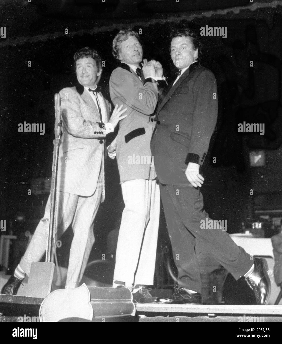 British actor John Mills, left, with American actor Danny Kaye, centre