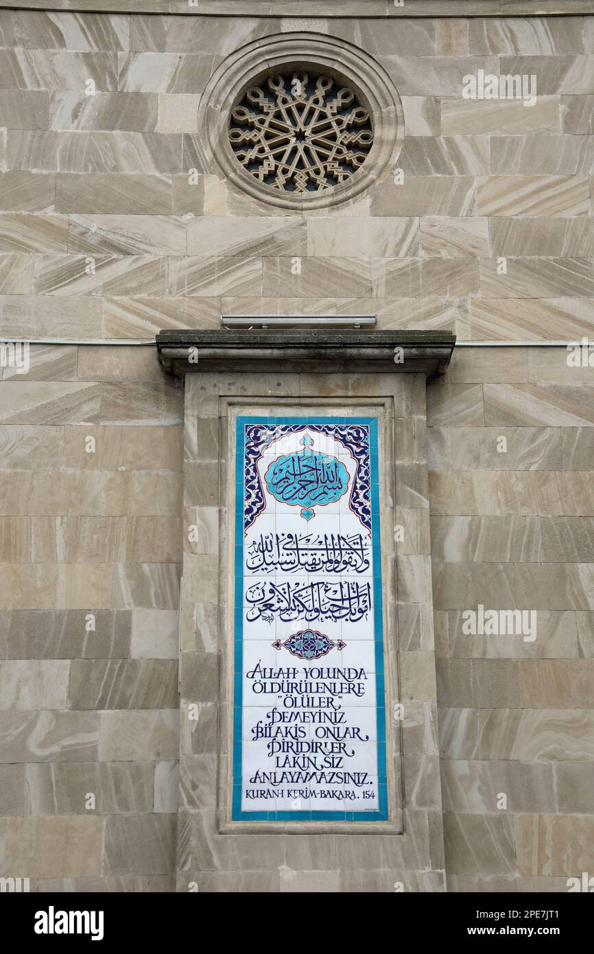 154th ayah from the Koran in Arabic and Turkish on the exterior of the Mosque of the Martyrs in Baku Stock Photo