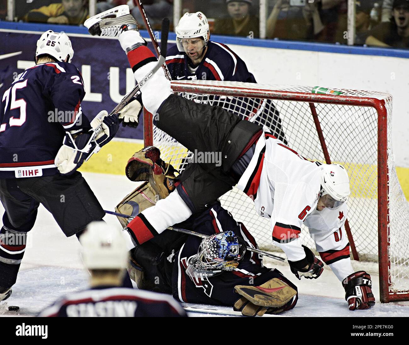 Team Canada Rick Nash flips over USA's goalie Rick DiPietro during third  period of an exhibition game in Friday, April 22, 2005 at the Quebec  Colisee in preparation for the world championship