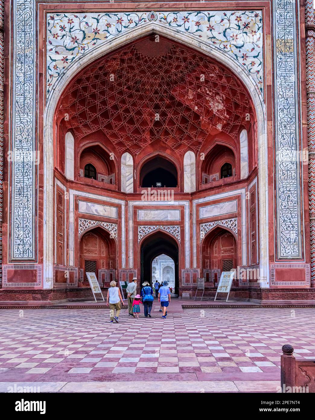 The facade of the Darwaza-i-rauzais is a grand recessed iwan in a rectangular frame, Its pishtaq arches include calligraphic inscriptions of the Koran Stock Photo