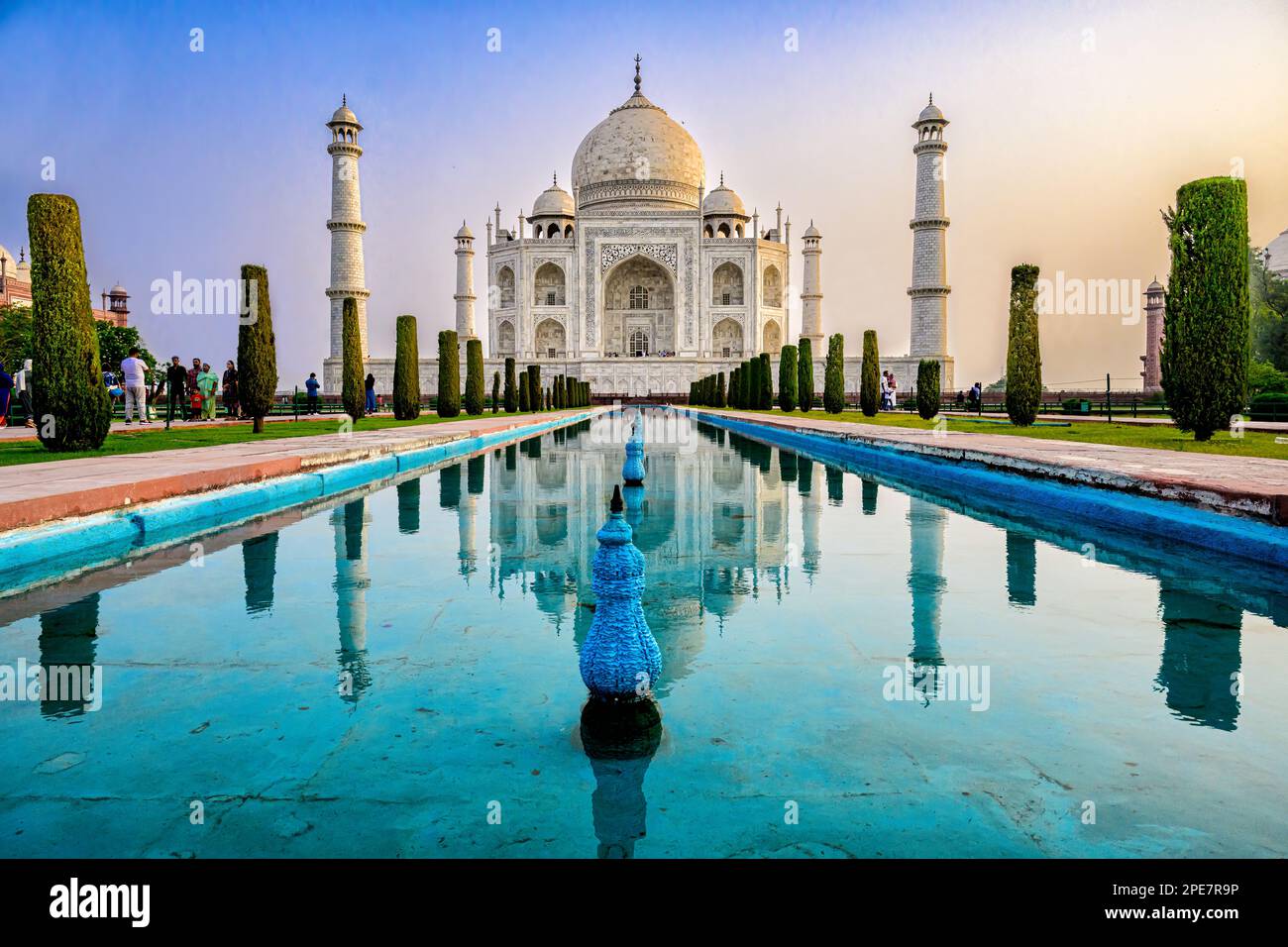 Symmetrical relection of the Taj Mahal in the reflecting pool situated in the perfectly ordered surrounding gardens, which are typical of Mughal art Stock Photo