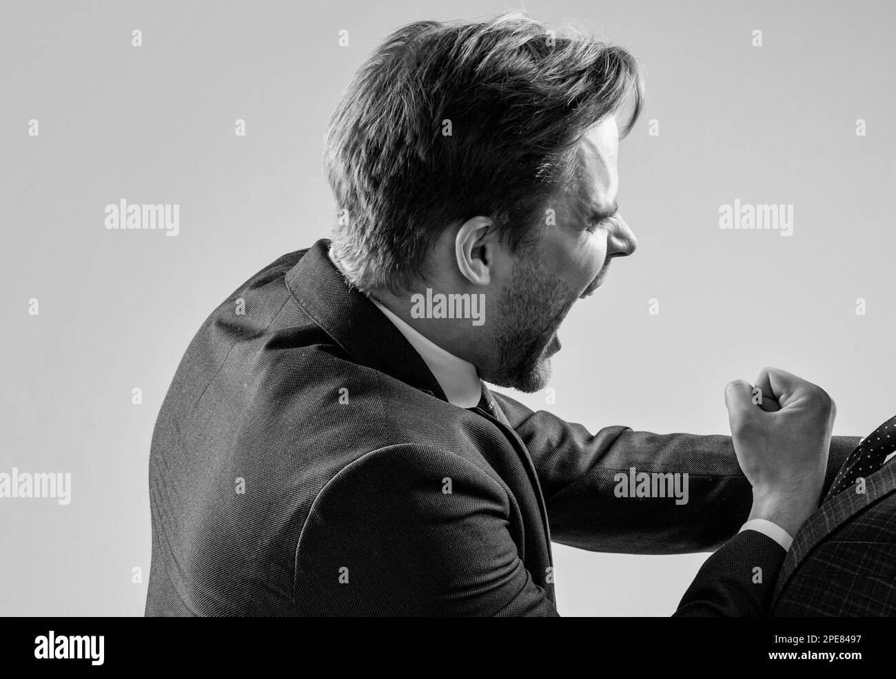 Fighting at work. Businessman engaged in fist fight. Fighting and conflicting. Aggressive man