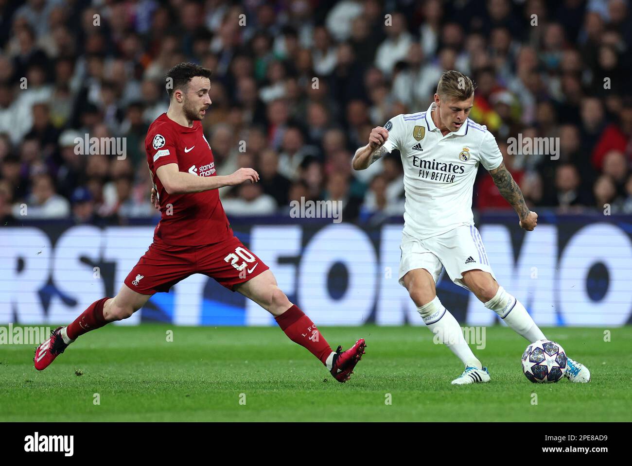 Liverpool's Diogo Jota (left) and Real Madrid's Toni Kroos in action during the UEFA Champions League round of sixteen second leg match at the Santiago Bernabeu Stadium, Madrid. Picture date: Wednesday March 15, 2023. Stock Photo