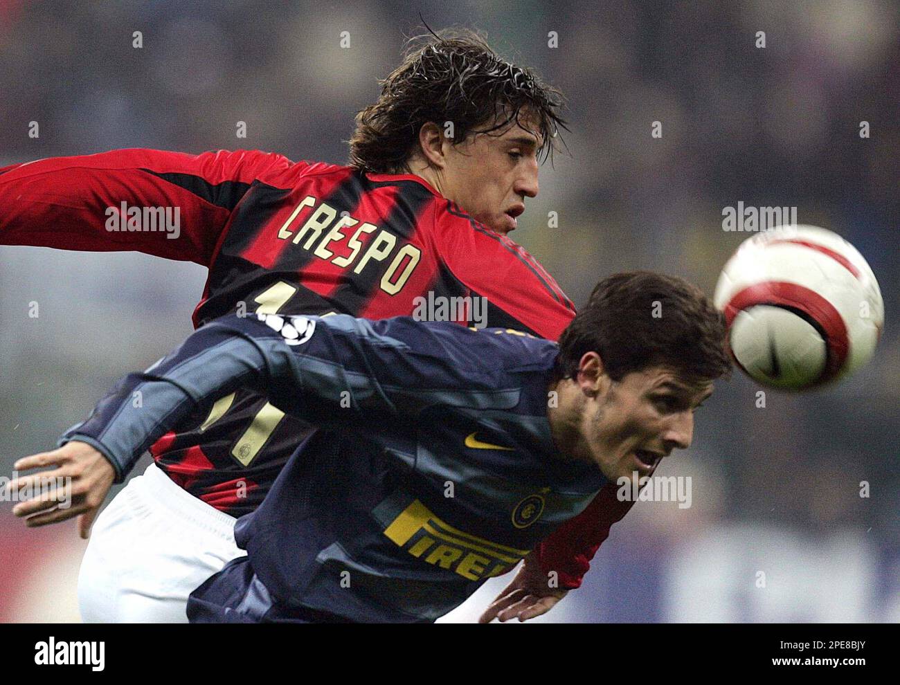 AC Milan's Argentine forward Hernan Crespo, left, and Inter's Argentine  player Javier Zanetti jump for the ball during their Champions League  quarterfinal second leg soccer match at the San Siro stadium in
