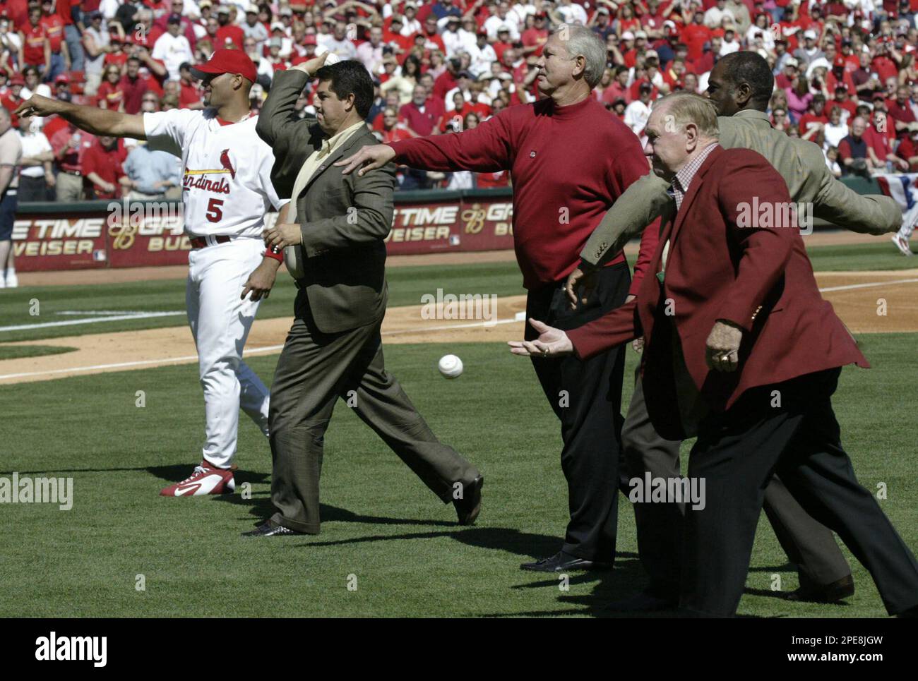 From left to right, St. Louis Cardinals' Albert Pujols, Tom Pagnozzi, Bob  Forsch, Bob Gibson and Red Schoendienst make the first pitches before the  Cardinals baseball game against the Philadelphia Phillies at